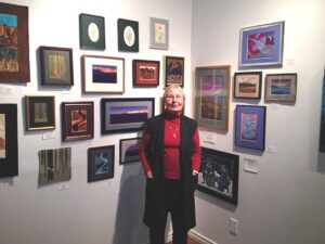 Joan with small art quilts